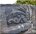 Carved stone in wall of St Blane