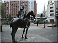 A horseman, watching the traffic