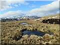 NN6817 : Half-frozen bog pools north-west of Sròn na Maoile by Alan O'Dowd