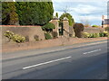 Garden boundary wall and gateway at the almshouses