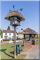 TQ1448 : Dovecote and bus shelter by Ian Capper