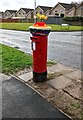 ST2793 : Spring-themed hat on a pillar box, Coed Eva, Cwmbran by Jaggery