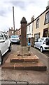 Cross on SE side of High Street