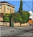 Dark green cabinet on a Penperlleni corner