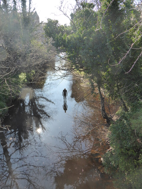 Antony Gormley statue in the Water of Leith