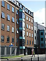 Washing the windows on Wapping Wharf