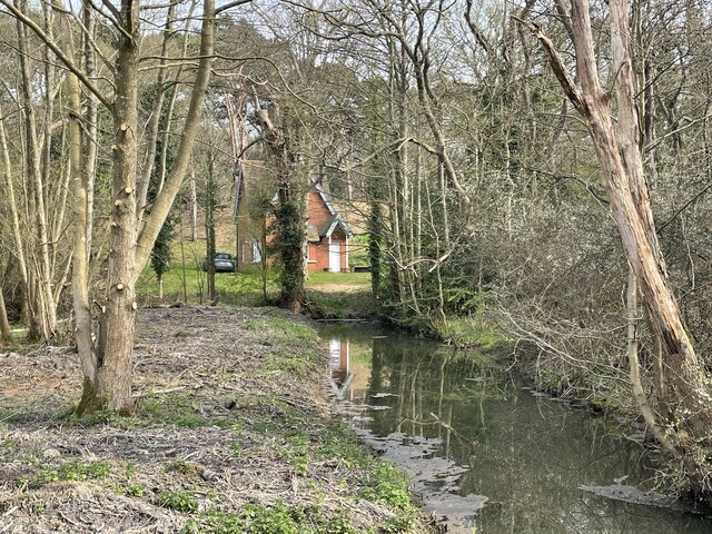 Drainage ditch and view of East Cottage
