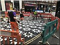 Hot melt painting of flowers on the road