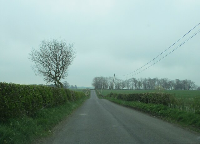 Road  toward  Rock  through  open  countryside
