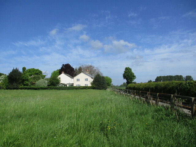 Grass field and house near Lower Layham