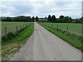 Fence enclosed minor road between St Marys and Inchberry