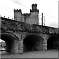 Railway arches and Newcastle Castle seen from near The Black Gate