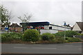 The side view of Tesco Express on Asquith Boulevard, West Knighton