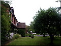 Houses in Barnfield Road glimpsed from Rotherlands Path