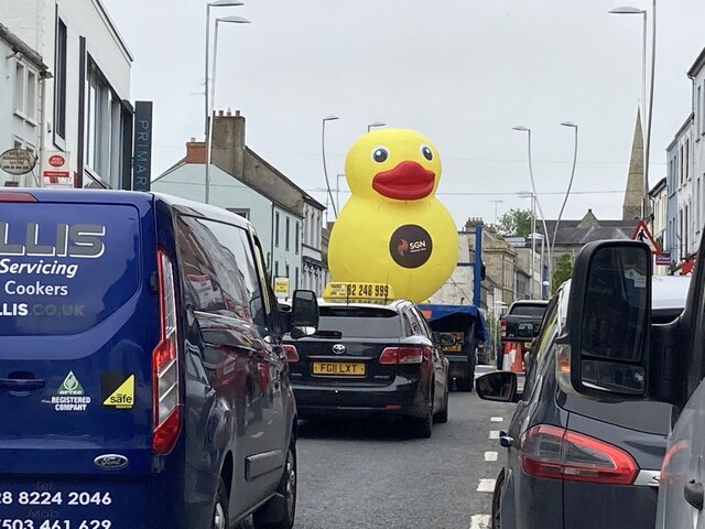 Large inflatable duck passing through Market Street, Omagh