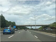 TQ0497 : Footbridge crossing M25 northbound by Dave Thompson