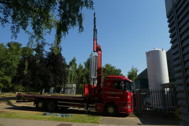 Crane lifting the new heat exchanger