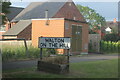 Sign entering Walton on the Hill, Stafford