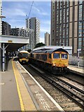 TQ3875 : Trains passing at Lewisham railway station by David Robinson