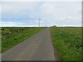 ND2965 : Fence-lined minor road near to Alterwall by Peter Wood