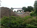 Flood wall at the rear of Riverside Park and Rowley Meadows