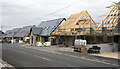NZ1025 : Houses under construction in Butterknowle by Trevor Littlewood