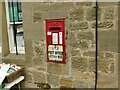 Postbox on the wall of Lesbury post office