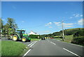 Tractor waiting to join the A494 at Bethel