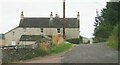NX6945 : House at Dromore farm by Gordon Hatton
