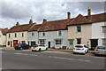 Vets and houses, main street east side, Long Melford