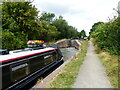 Canal barge approaching Lock 51, and towpath, Stratford-upon-Avon Canal