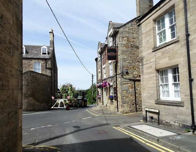 Tractor passing The Wheatsheaf in... © Robert Graham cc-by-sa/2.0 ...