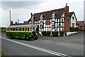 A vintage bus arriving at the Drum and Monkey