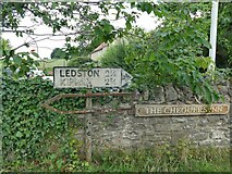 SE4529 : Old roadsign in Ledsham village centre by Stephen Craven