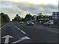 The A422 passing an Esso filling station