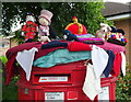 Close up Yarn bombed double aperture Elizabeth II postbox on Pennylets Green, Stoke Poges