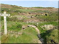 Footbridge and signpost at Caer Bwdy Bay