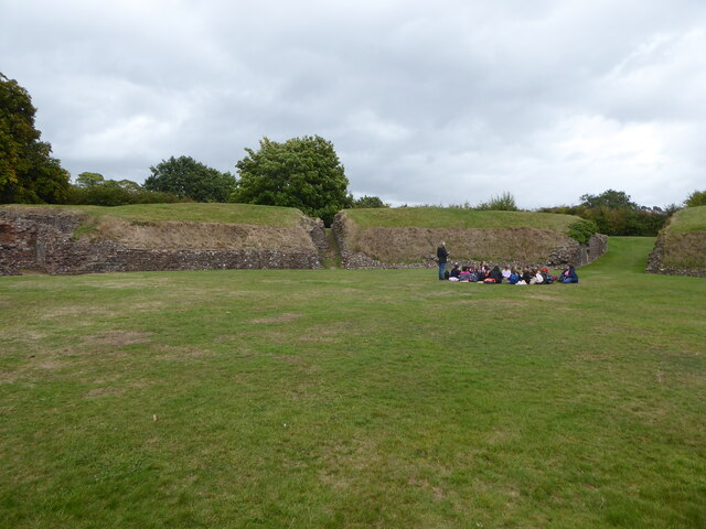 Inside Caerleon Amphitheatre, with a primary school group