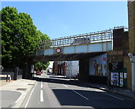 TQ2476 : Railway bridge over New King's Road by JThomas
