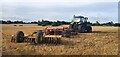 Farm machinery from Grange Farm in a recently ploughed field