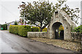 Road passing war memorial lych gate