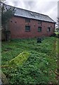 Brick building abutting the churchyard, Turnastone, Herefordshire