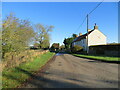 Minor road and housing at Langthorne