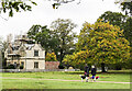 Dog walkers approaching Lion Lodge