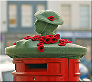 NT7233 : A poppy display on a Kelso post box by Walter Baxter