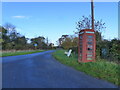 Telephone box and the road to Northington, Awre