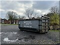 Roll-on roll-off waste container on hospital site