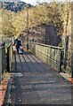 Walking across a footbridge over the Ebbw, Ebbw Vale