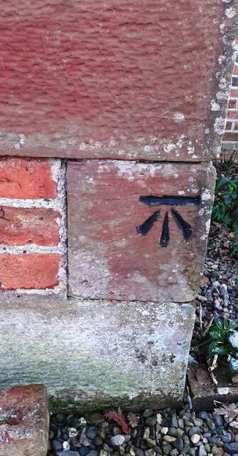 Benchmark on quoin of Troutbeck Cottage on south side of road