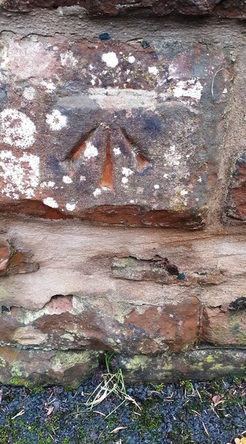 Benchmark on wall at entrance to St Christoph Cottage
